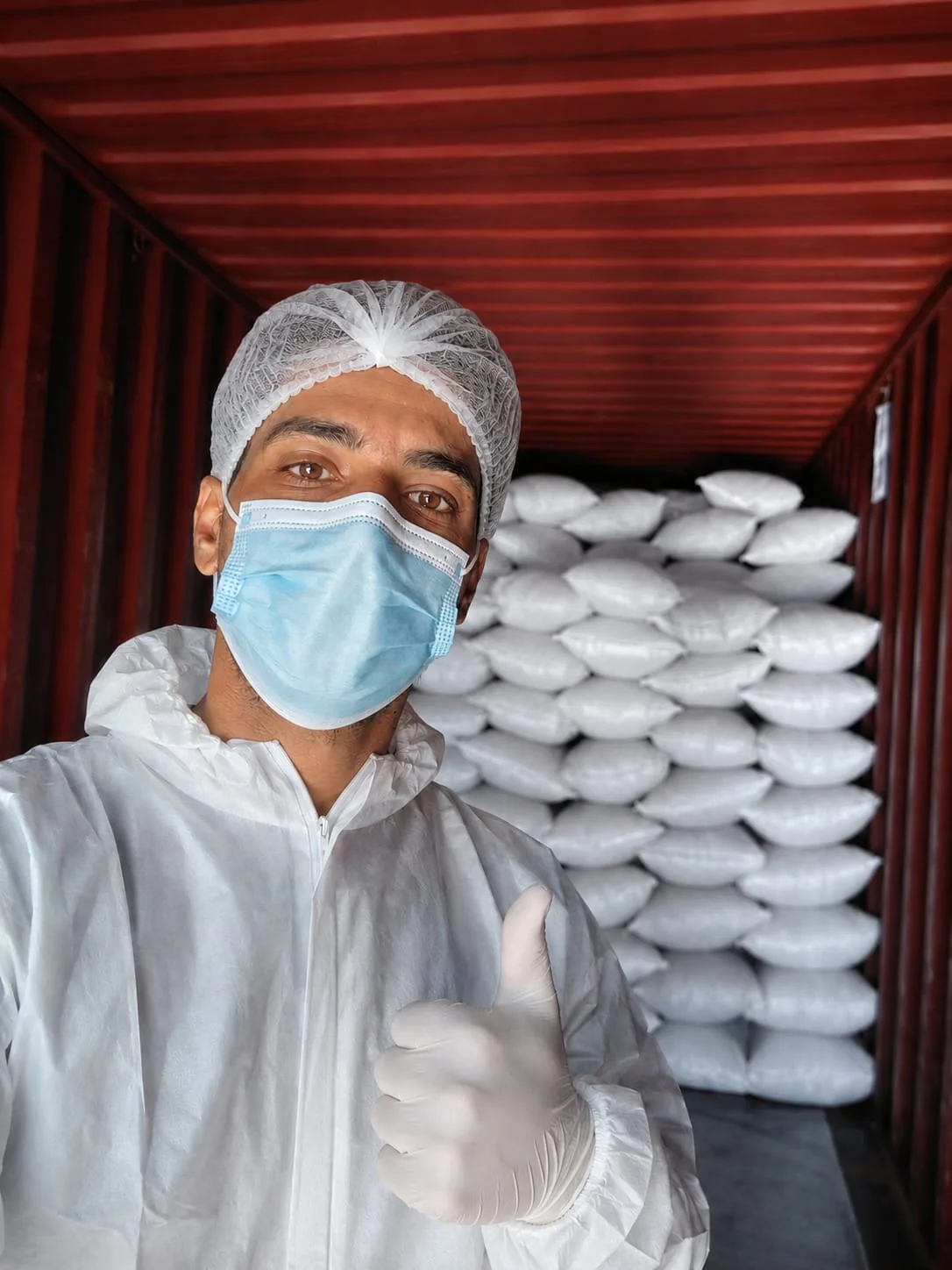 Bulk jute and woven bags staged for container loading