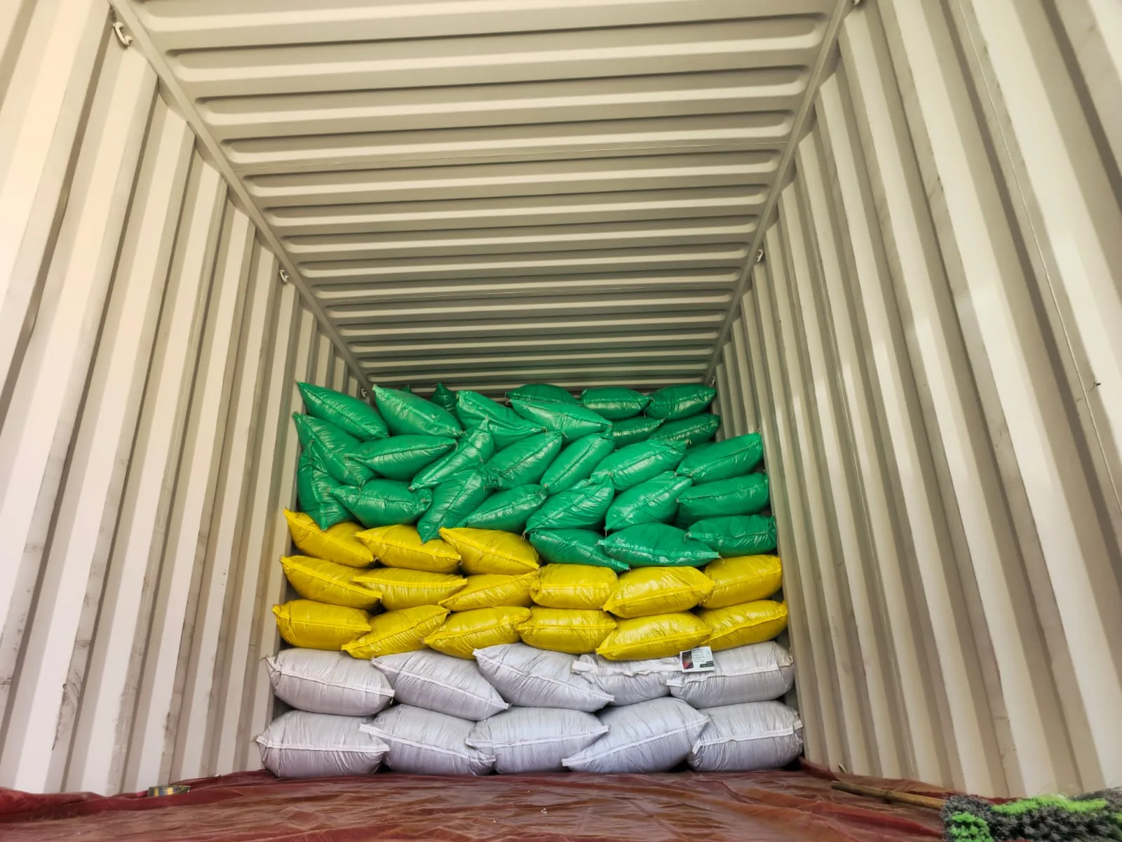 Palletized cartons of Herbs Gate products ready for export